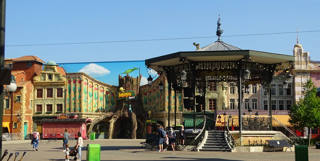 Dorpsplein with its ornate bandstand and colourful Plopsaland façades.