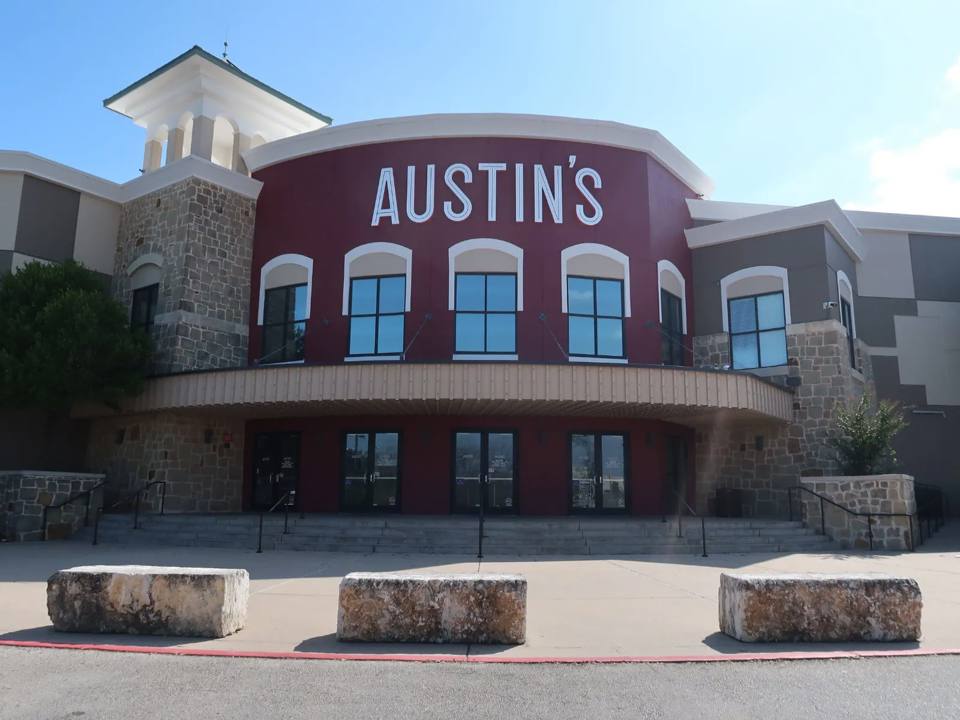 Austin’s Park main façade after the rebrand, with its large white name on a red background.