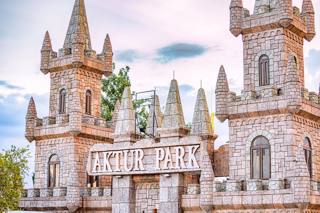 The castle-shaped entrance frontage carries the Aktur Park name.