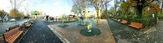 General panorama of Cita-Parc among the mature trees of Jardin Vauban.