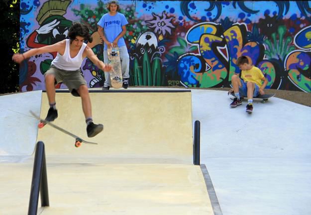Rails and ramps form a line through the skatepark.