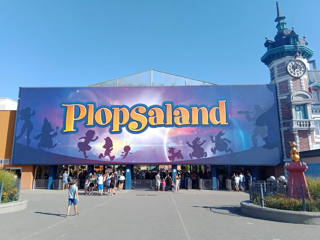The entrance to Plopsaland Belgium beneath its large illustrated sign.