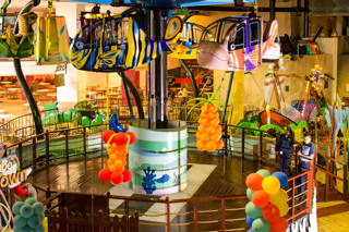Flying Fish vehicles dominate an open view across several Antic's Land attractions.