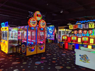 Wide view of the Hurst arcade with the laser-tag entrance beyond.