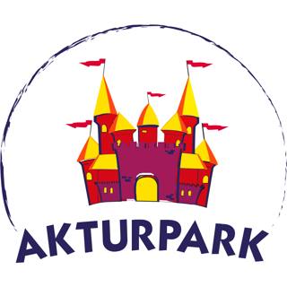 The red, yellow and violet castle of the Aktur Park emblem.